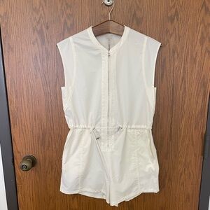 Cream colored romper by Calia .
